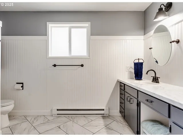 a bathroom with a sink and mirror