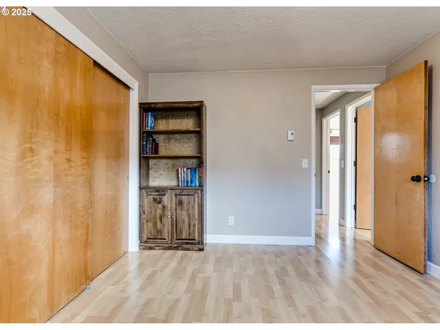 a view of walk in closet with white walls