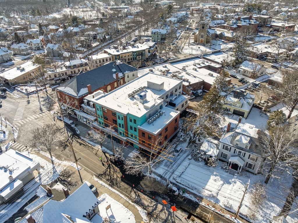 1151 Walnut Street, Unit 307 Newton, MA 02461 - Photo 27 of 32 an aerial view of a house with a yard
