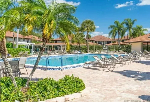 a view of swimming pool with a yard