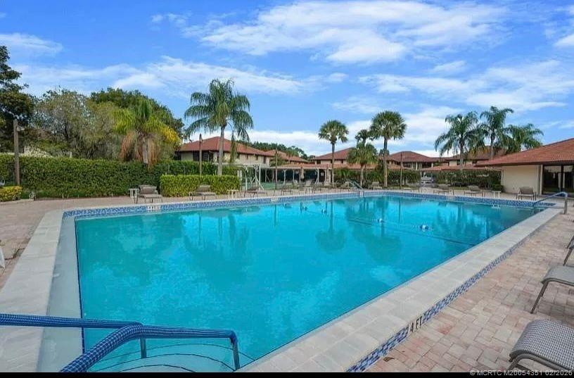 330 Southwest South River Drive, Unit 201 Stuart, FL 34997 - Photo 19 of 37 a view of swimming pool with a yard