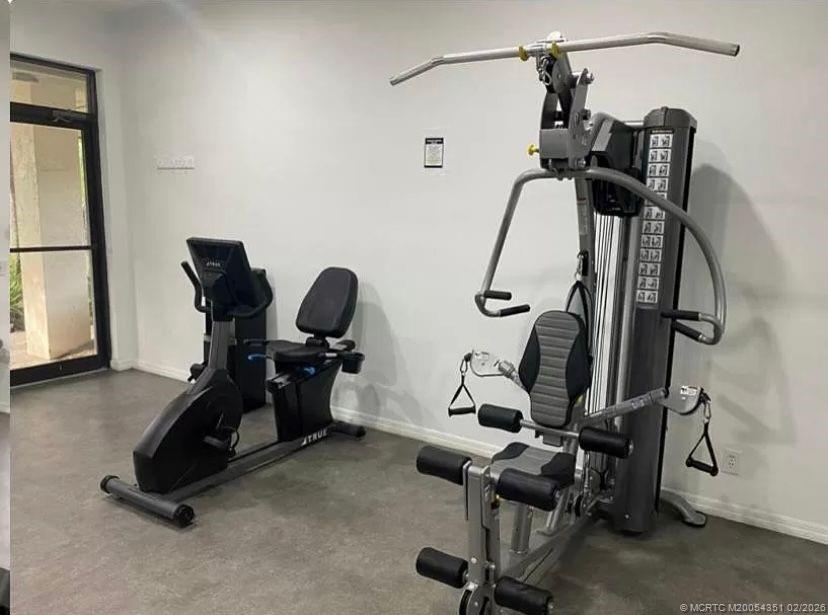 330 Southwest South River Drive, Unit 201 Stuart, FL 34997 - Photo 20 of 37 a view of a room with gym equipment