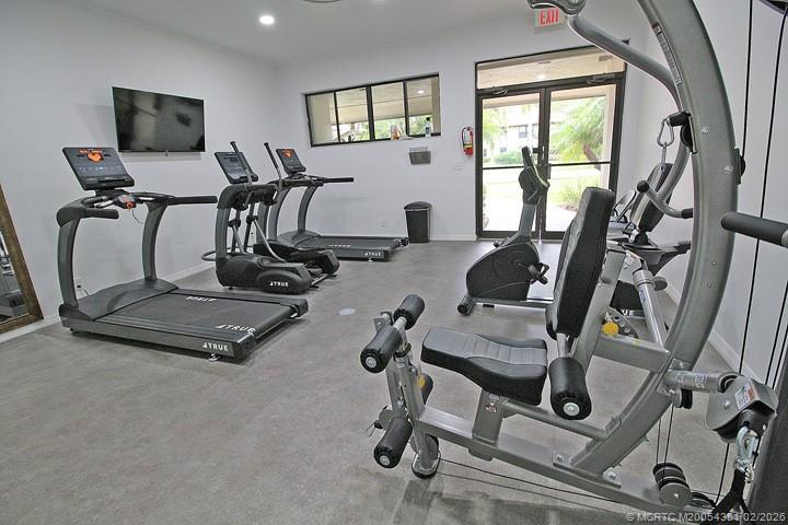 330 Southwest South River Drive, Unit 201 Stuart, FL 34997 - Photo 26 of 37 a view of a room with gym equipment