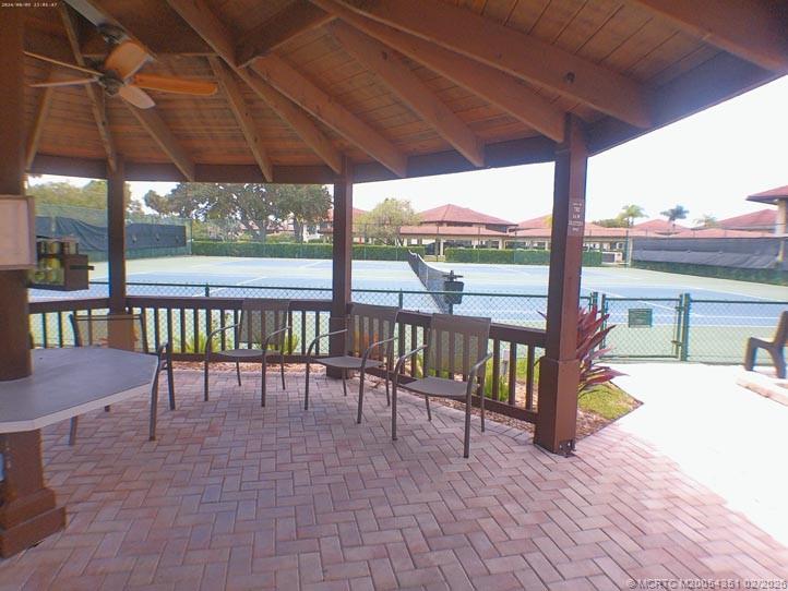 330 Southwest South River Drive, Unit 201 Stuart, FL 34997 - Photo 29 of 37 a view of a chairs and table in the patio