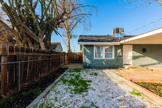 a yellow house with a outdoor space