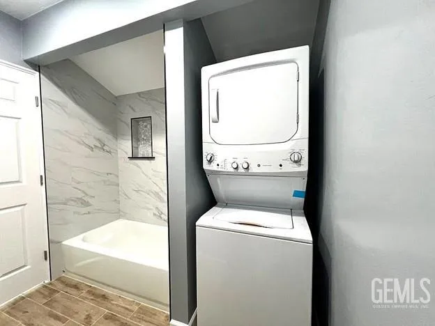 a kitchen with stainless steel appliances white cabinets stove and a refrigerator