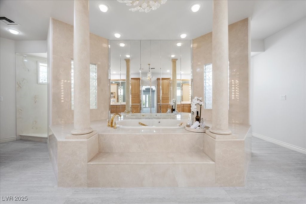 640 Quail Covey Road Henderson, NV 89002 - Photo 16 of 75 Primary Bathroom featuring a jaquzzi bath, decorative columns, Tile finished floors, and recessed lighting