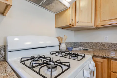 a kitchen with a stove and a sink