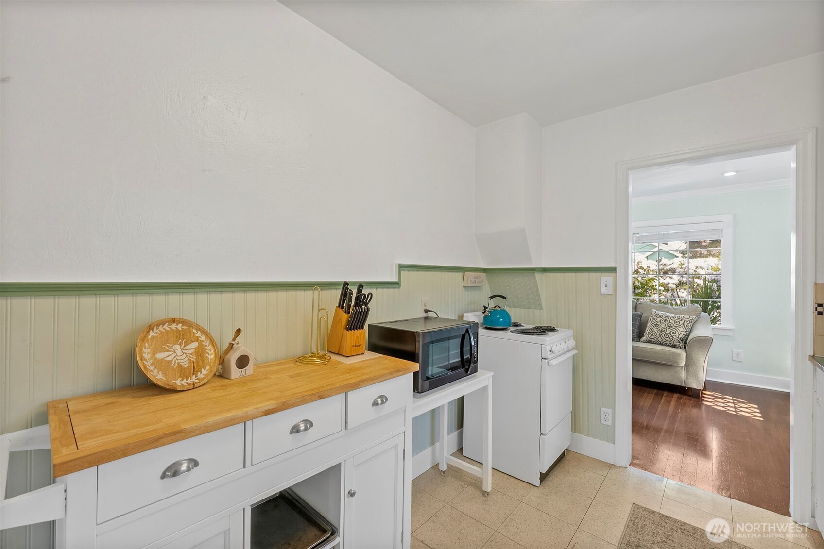 2121 5th Street Bremerton, WA 98312 - Photo 15 of 32 a kitchen with a stove and wooden floor