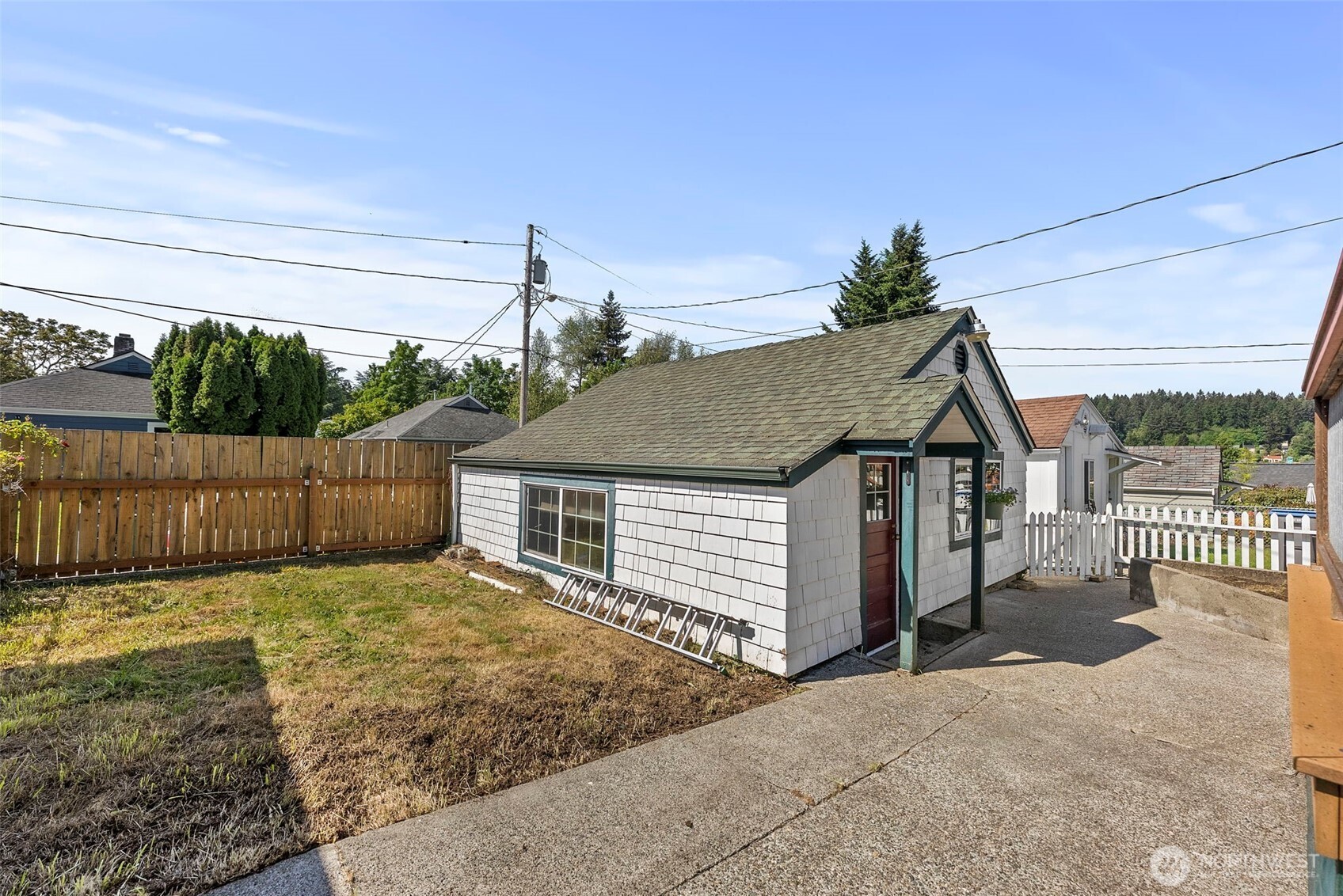 2121 5th Street Bremerton, WA 98312 - Photo 23 of 32 a view of a small house with wooden fence