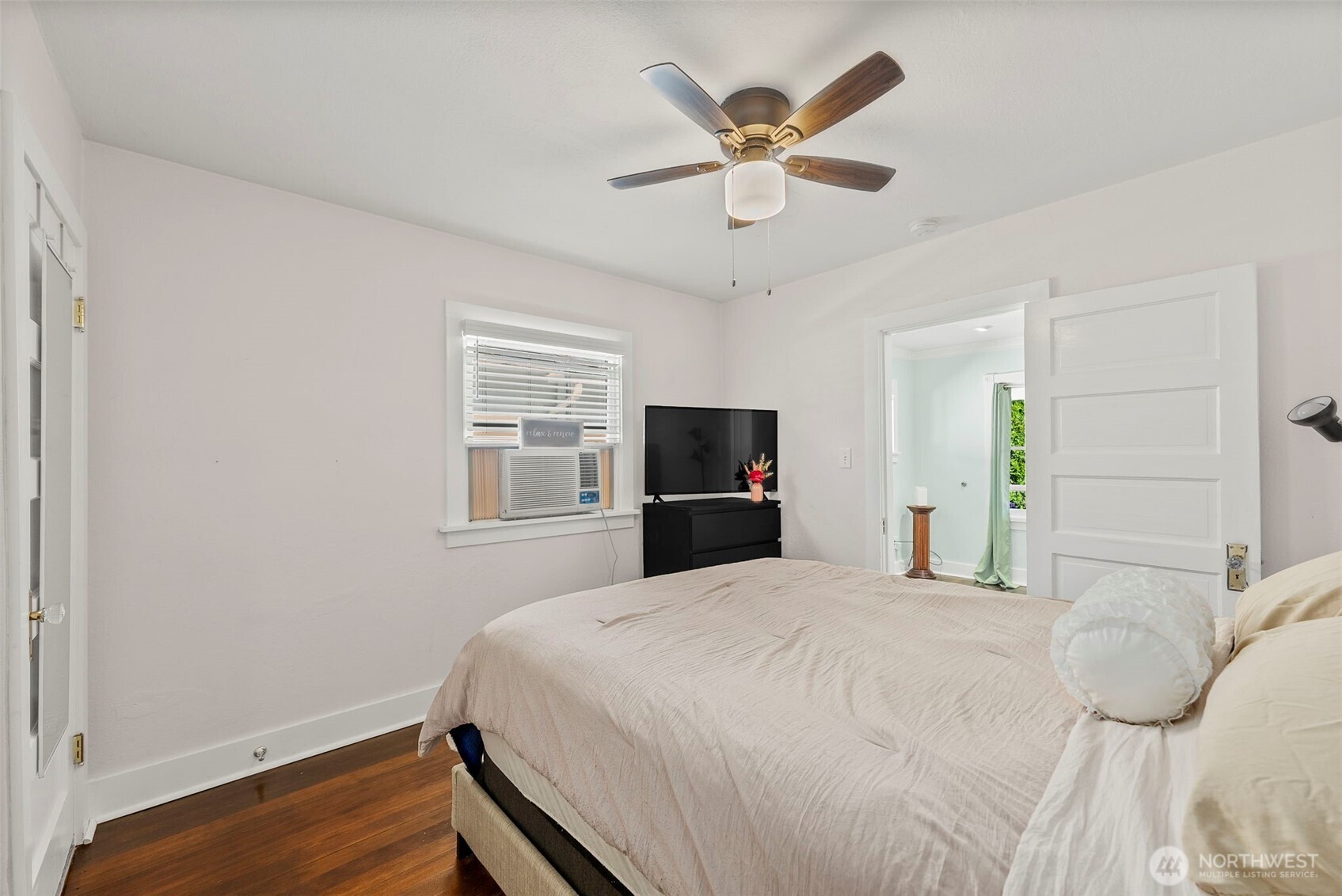 2121 5th Street Bremerton, WA 98312 - Photo 8 of 32 a bedroom with a large bed and a tv