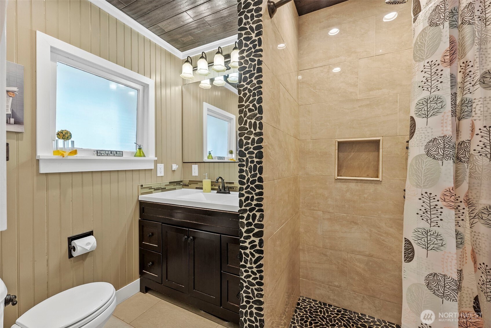 2121 5th Street Bremerton, WA 98312 - Photo 9 of 32 a bathroom with a sink a toilet and shower
