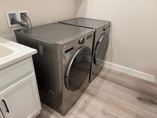 a utility room with dryer and washer