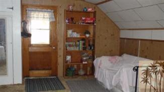 25600 Seneca Road Idyllwild, CA 92549 - Photo 6 of 9 a bedroom with a bed and a walk in closet