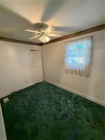 a view of a big room with carpet