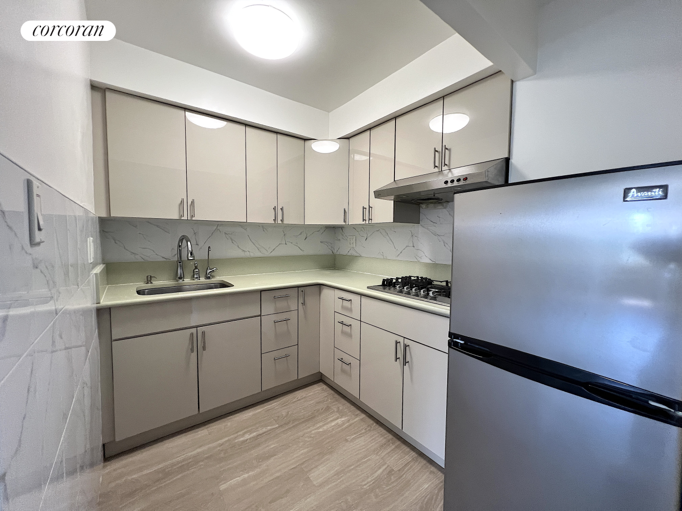 50 Bayard Street, Unit 6T Manhattan, NY 10013 - Photo 3 of 6 a kitchen with stainless steel appliances granite countertop a sink stove and cabinets