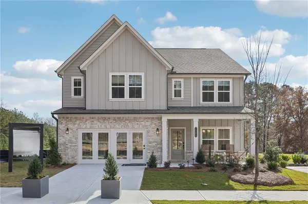a front view of a house with yard
