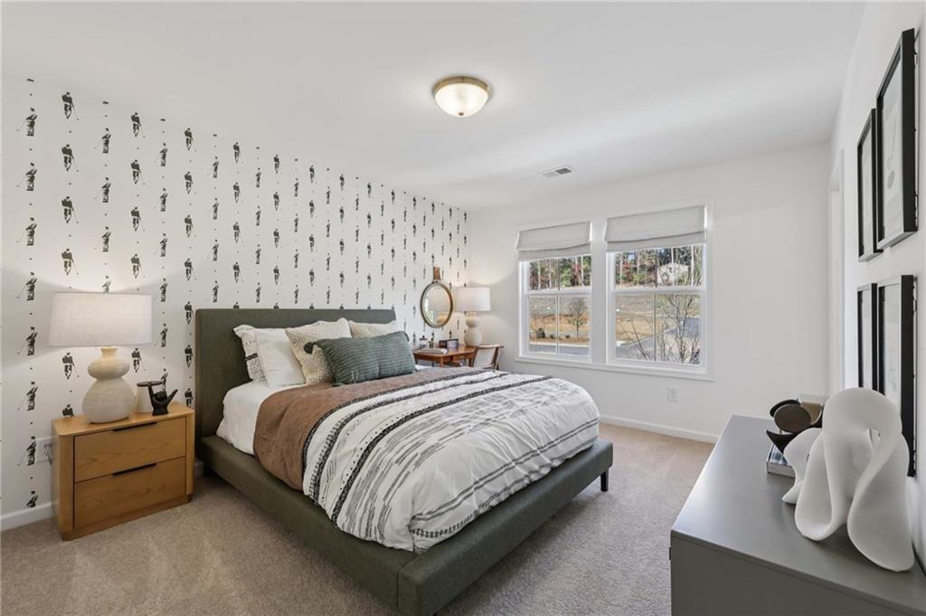 6145 Kismet Road Buford, GA 30518 - Photo 30 of 43 a bedroom with a bed and a window