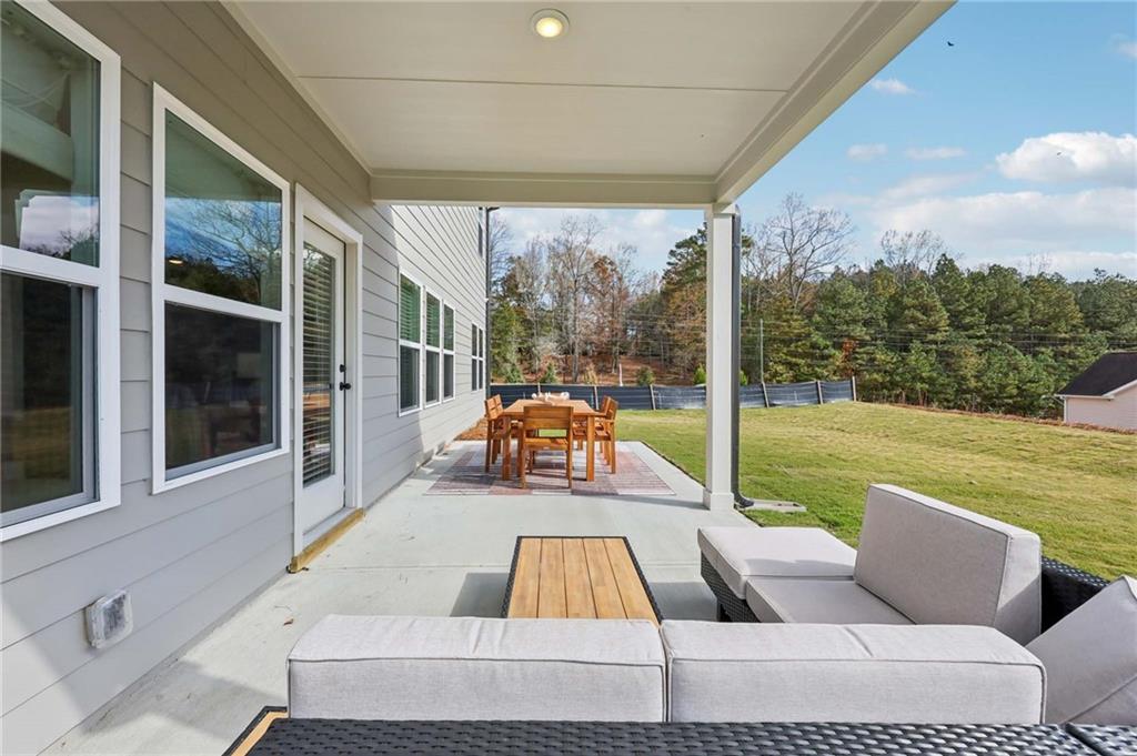 6145 Kismet Road Buford, GA 30518 - Photo 42 of 43 a view of swimming pool with couches and wooden floor
