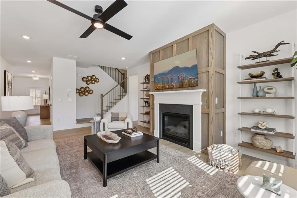 6145 Kismet Road Buford, GA 30518 - Photo 7 of 43 a living room with furniture and a fireplace