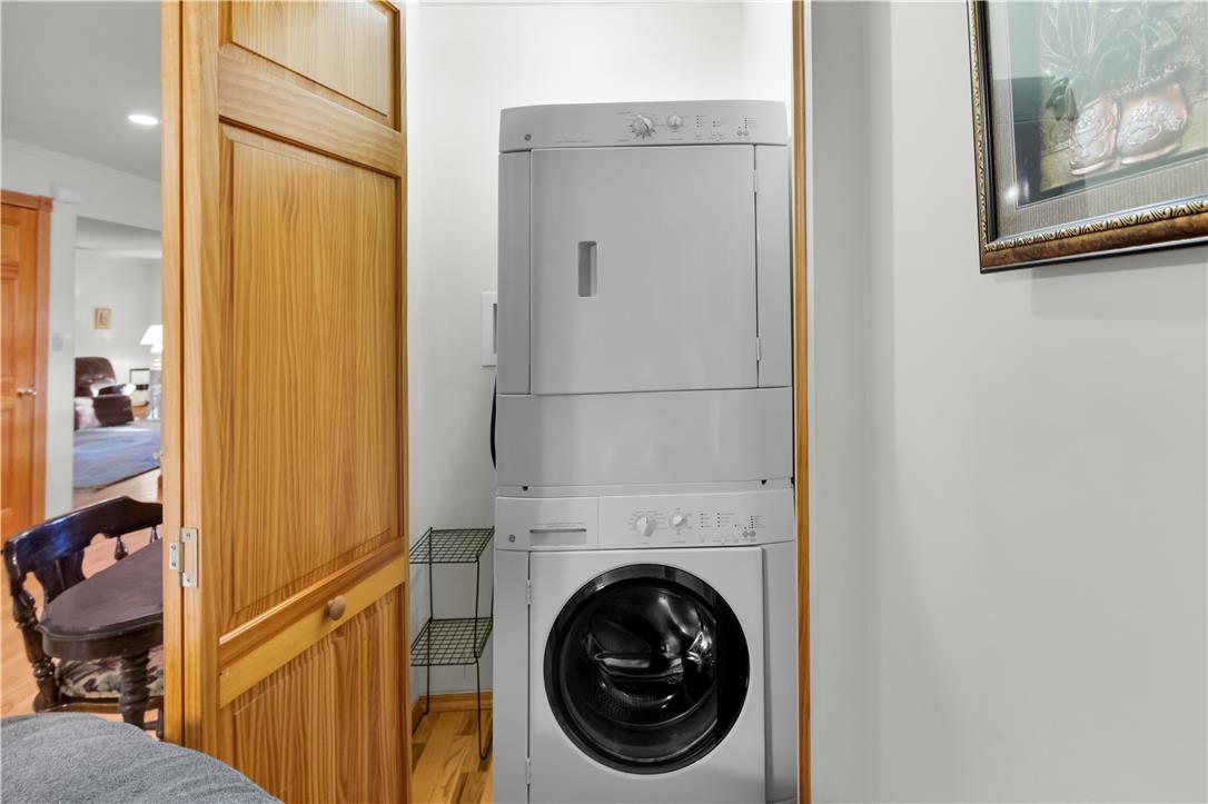 3915 Hecktown Road Bethlehem, PA 18020 - Photo 32 of 42 A stacked laundry setup integrates seamlessly behind handsome wood folding doors.