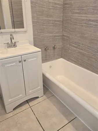 a bathroom with a sink and a bathtub
