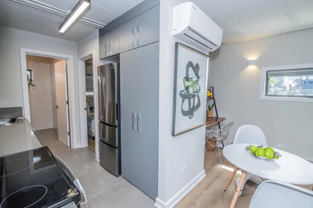 a view of a kitchen with furniture and a kitchen