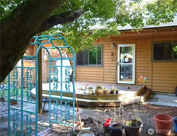 a backyard of a house with outdoor seating