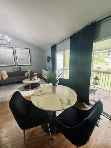 a living room with furniture and a table