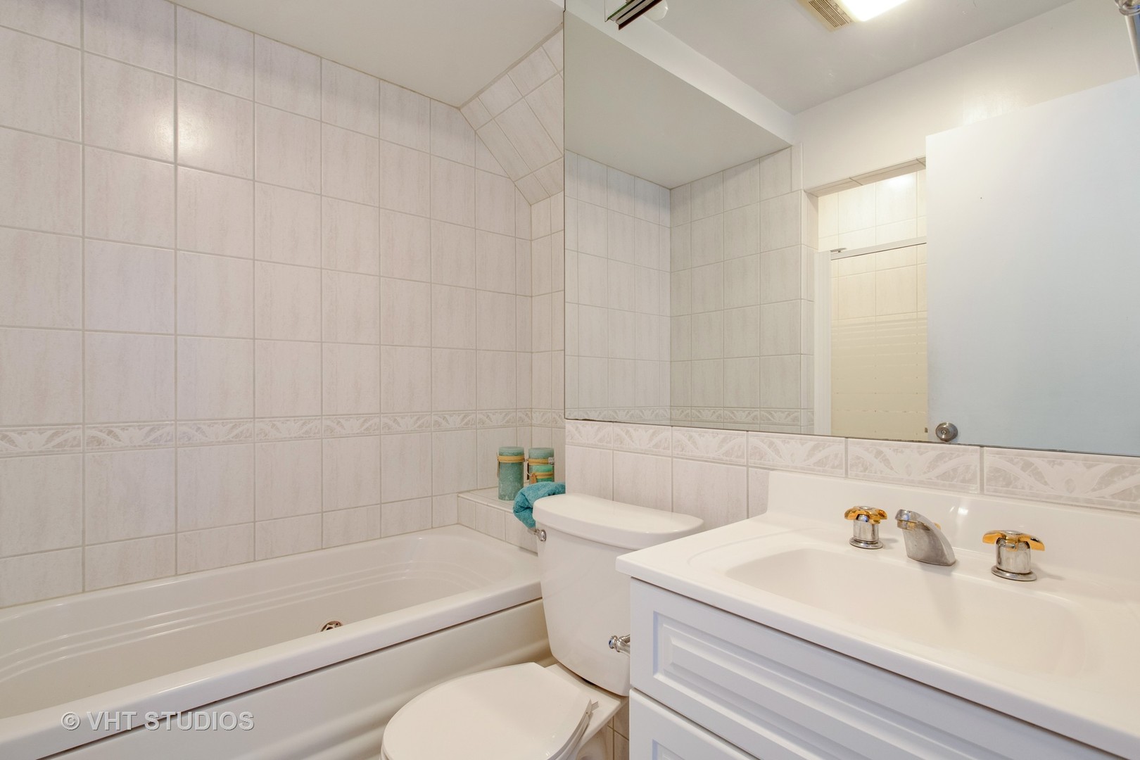 731 Hibbard Road Wilmette, IL 60091 - Photo 15 of 18 a bathroom with a sink a toilet and shower