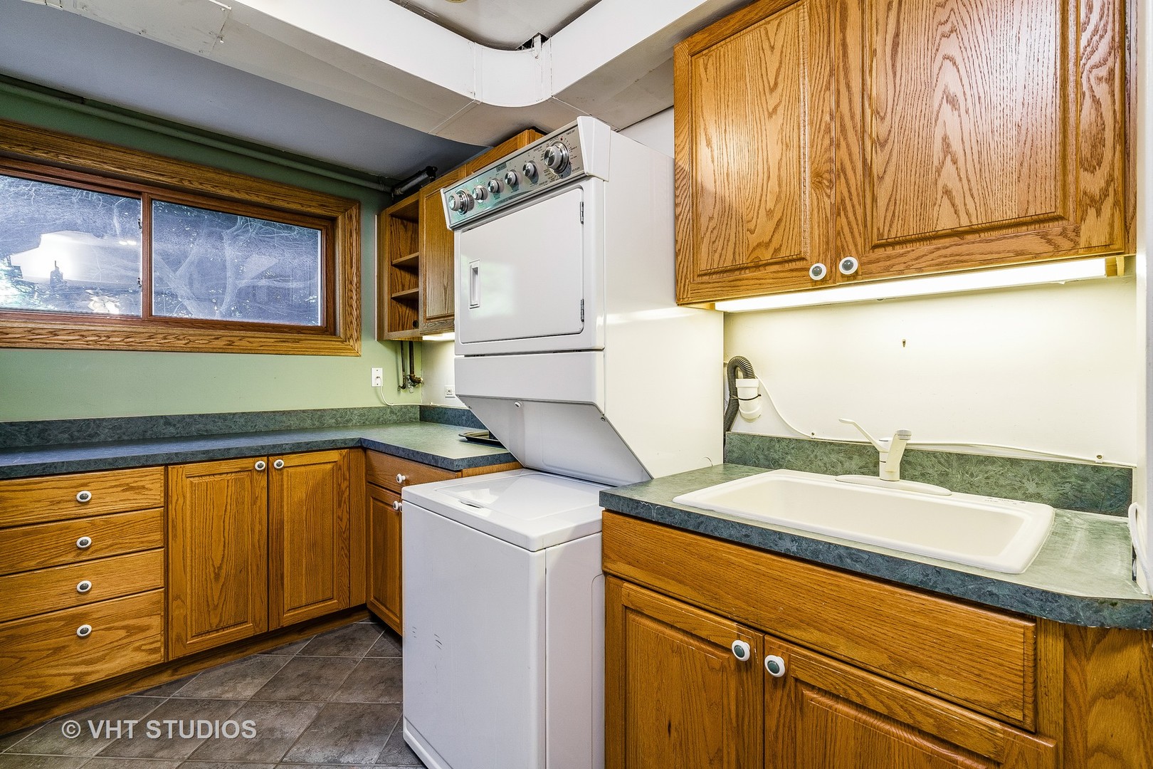 731 Hibbard Road Wilmette, IL 60091 - Photo 18 of 18 a utility room with a sink washer and dryer