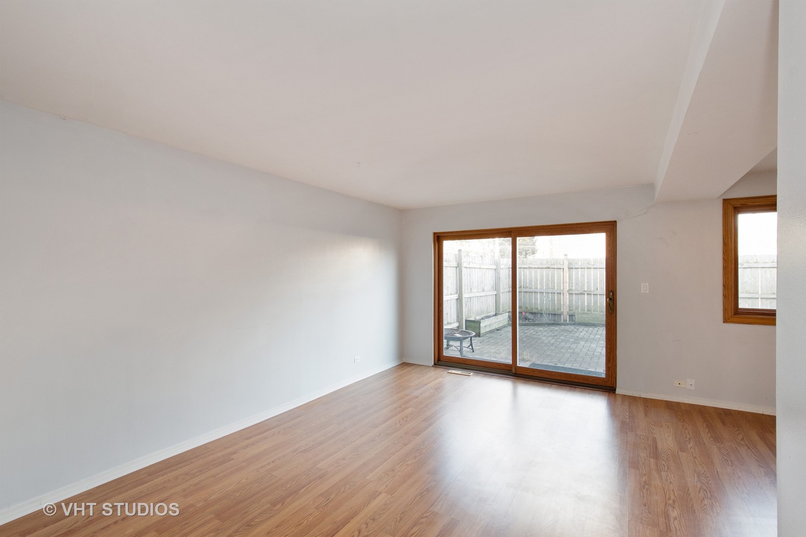 731 Hibbard Road Wilmette, IL 60091 - Photo 4 of 18 an empty room with wooden floor and windows