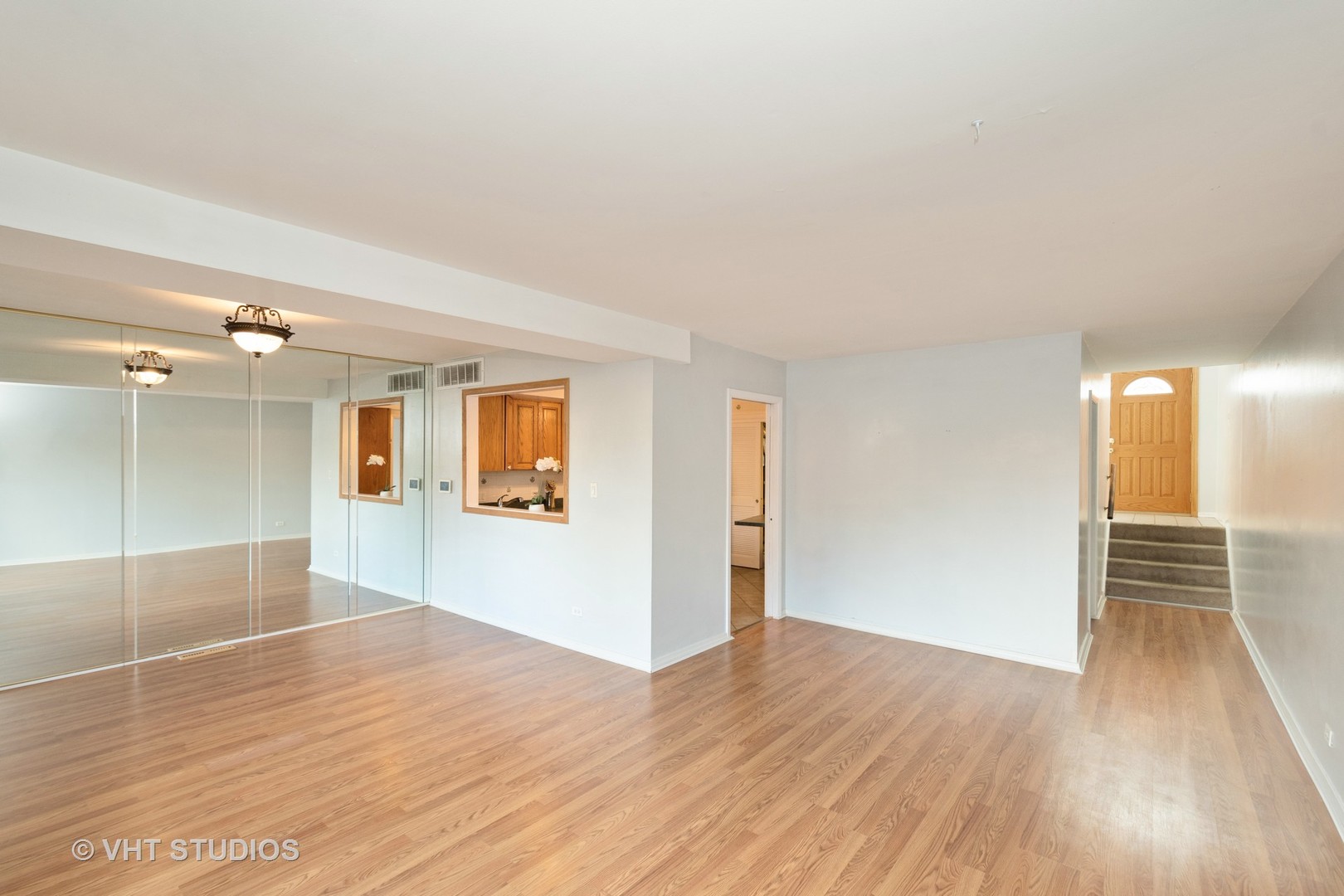 731 Hibbard Road Wilmette, IL 60091 - Photo 5 of 18 an empty room with wooden floor and windows