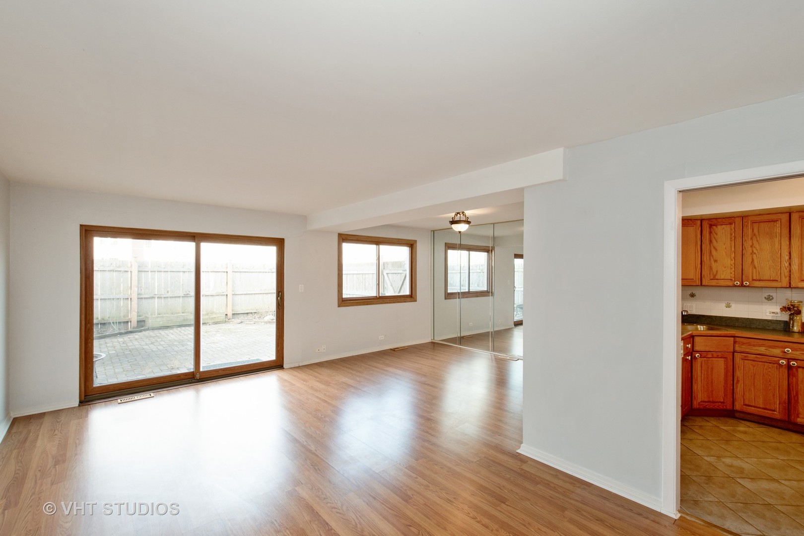 731 Hibbard Road Wilmette, IL 60091 - Photo 6 of 18 an empty room with wooden floor and windows