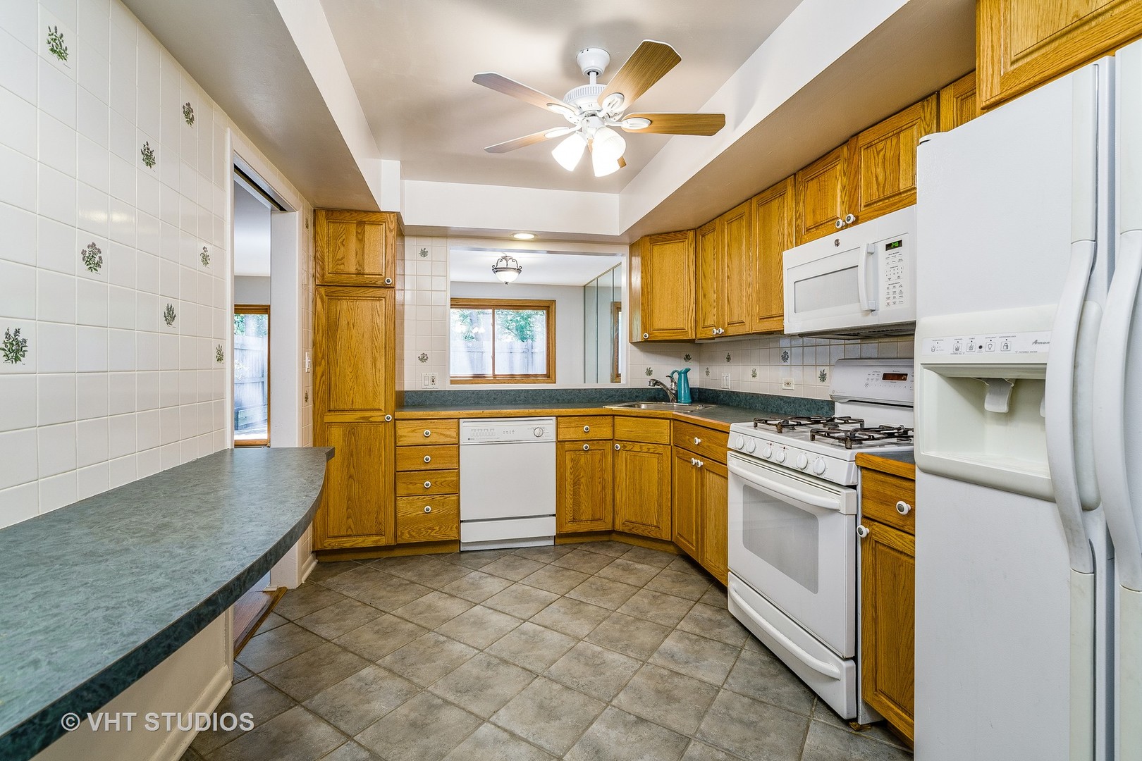 731 Hibbard Road Wilmette, IL 60091 - Photo 7 of 18 a kitchen with stainless steel appliances granite countertop a stove a sink and a refrigerator