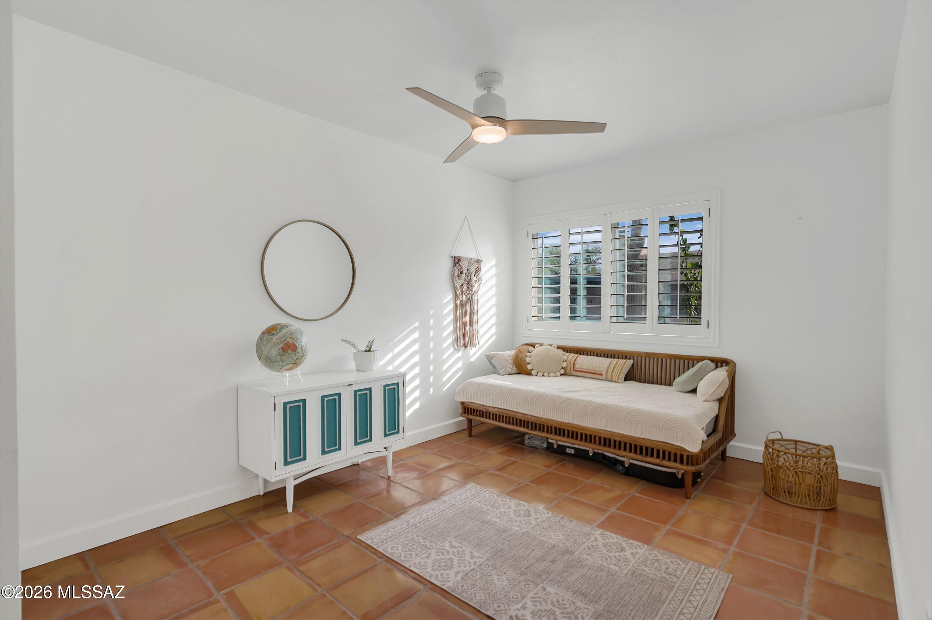 6941 East Rivercrest Road Tucson, AZ 85750 - Photo 18 of 32 a living room with furniture and a window