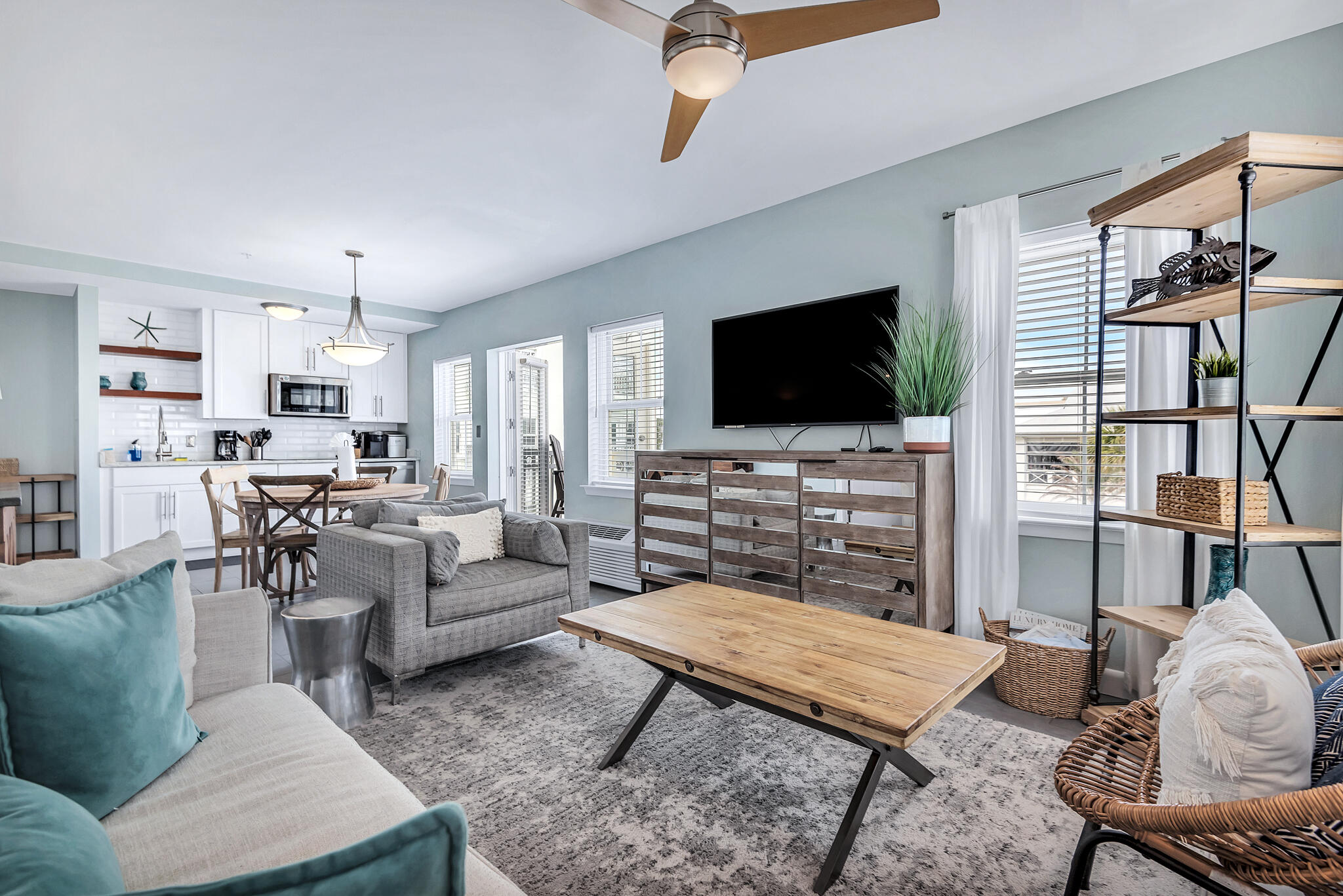 45 Town Center Loop, Unit 314 Santa Rosa Beach, FL 32459 - Photo 14 of 38 a living room with furniture and a flat screen tv