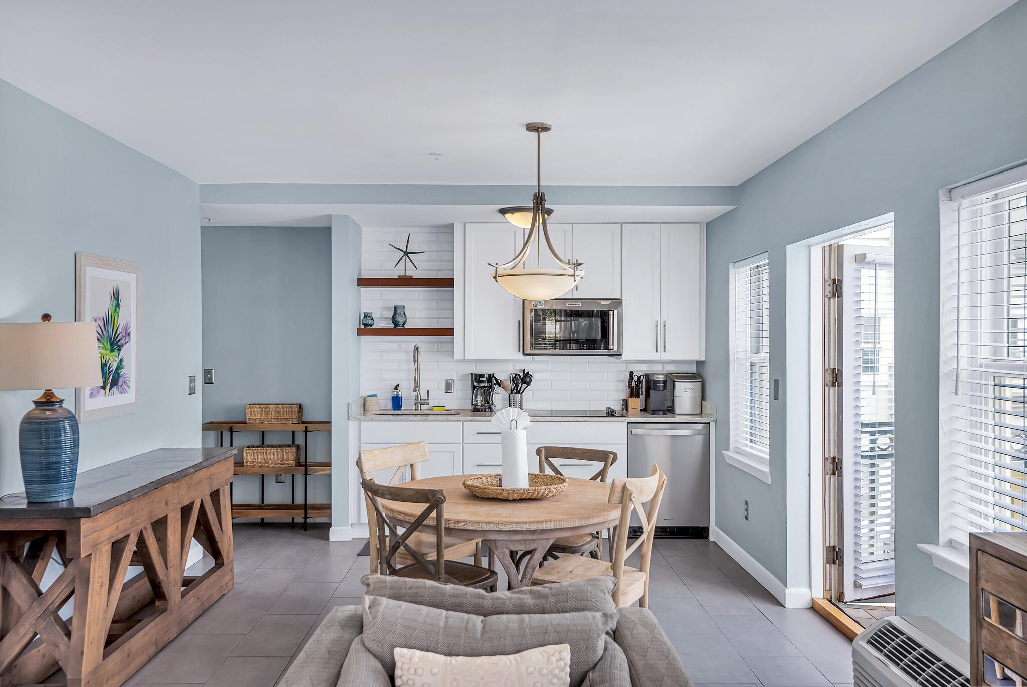 45 Town Center Loop, Unit 314 Santa Rosa Beach, FL 32459 - Photo 2 of 38 a dining room with furniture a chandelier and wooden floor