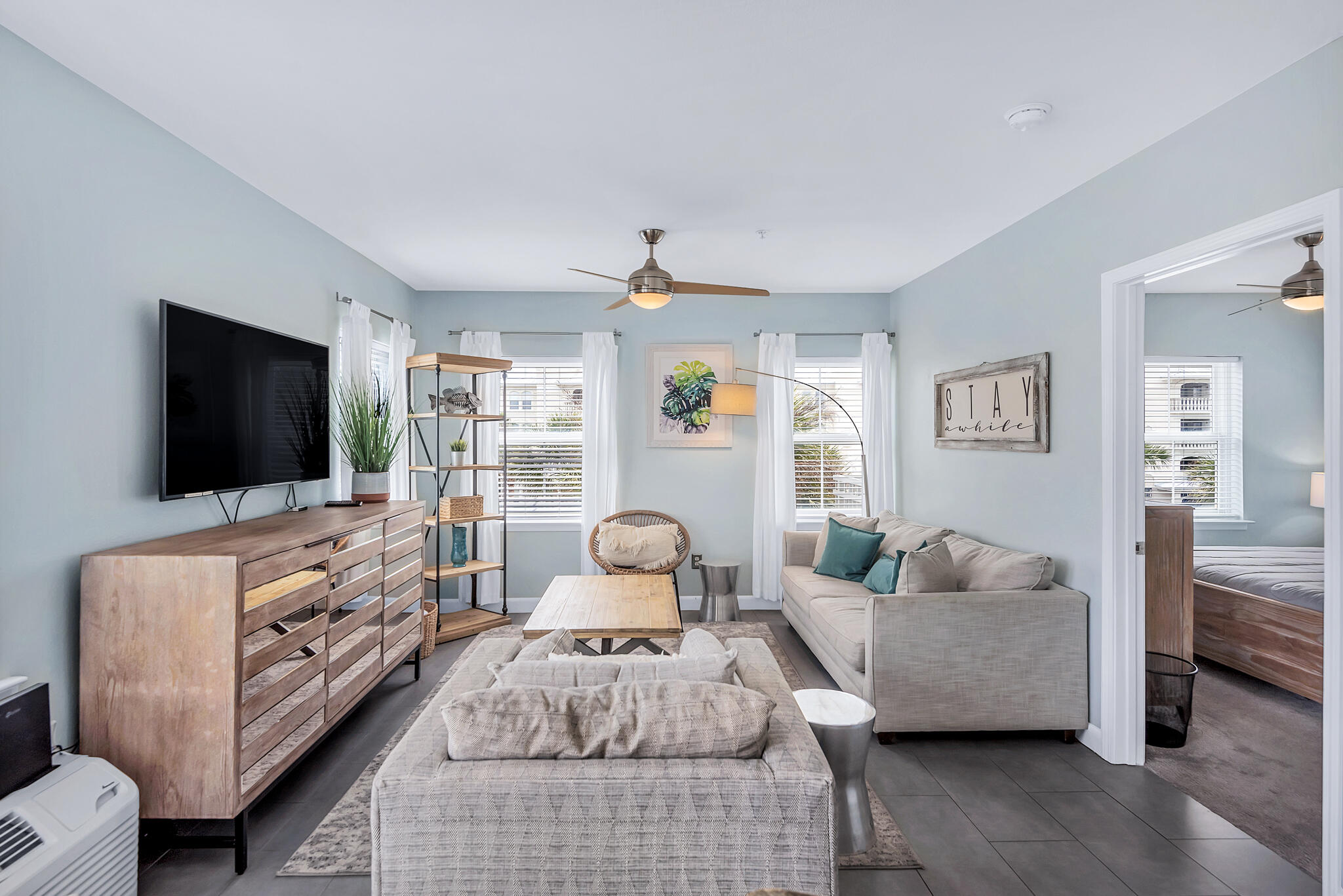 45 Town Center Loop, Unit 314 Santa Rosa Beach, FL 32459 - Photo 6 of 38 a living room with furniture and a flat screen tv