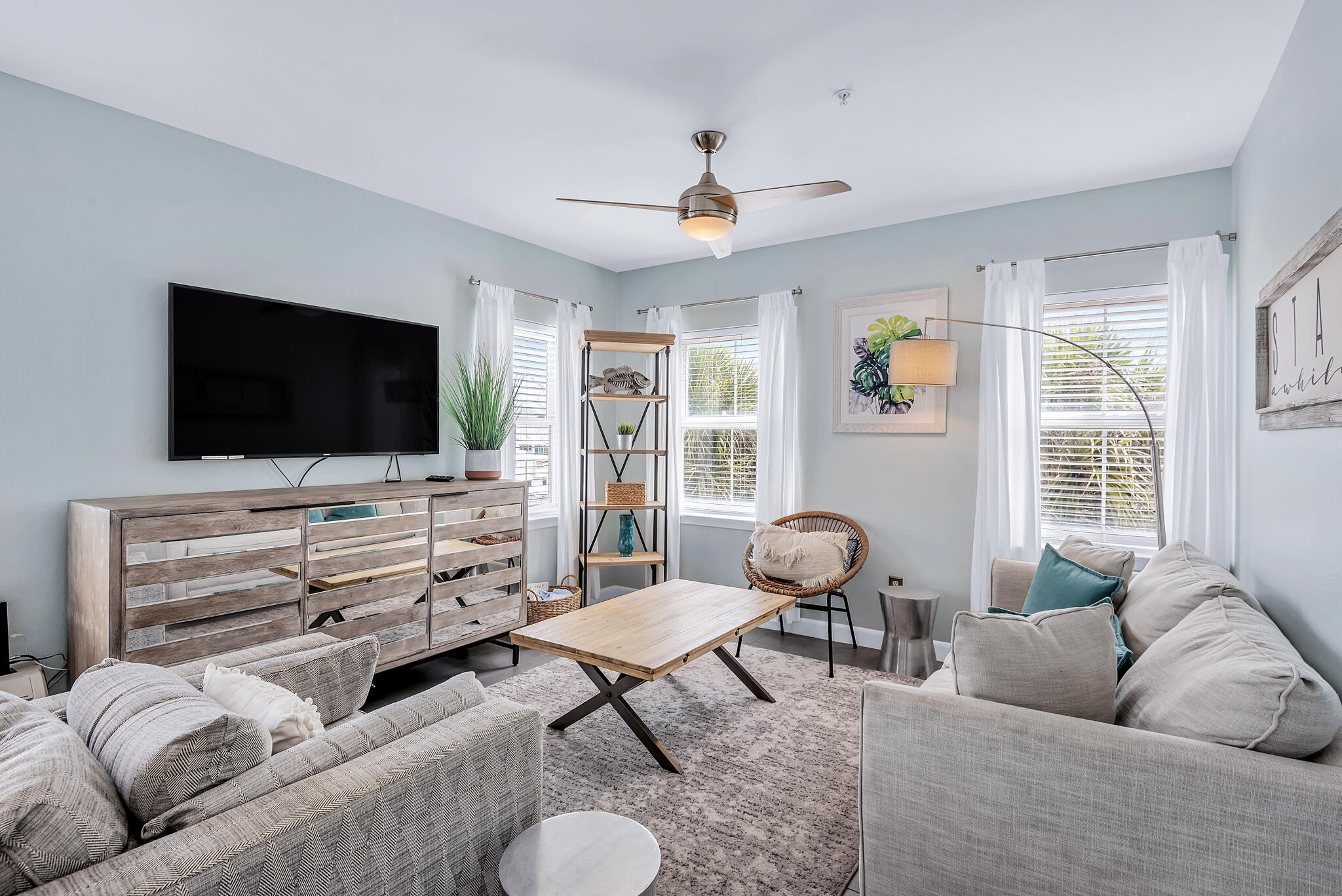 45 Town Center Loop, Unit 314 Santa Rosa Beach, FL 32459 - Photo 7 of 38 a living room with furniture and a flat screen tv