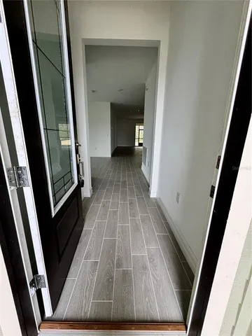 a view of hallway with a large door