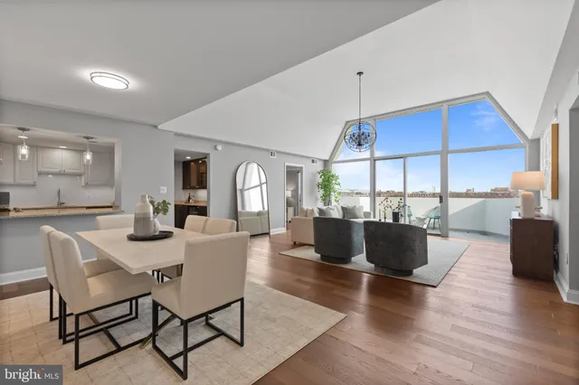 a view of a dining room with furniture window and wooden floor
