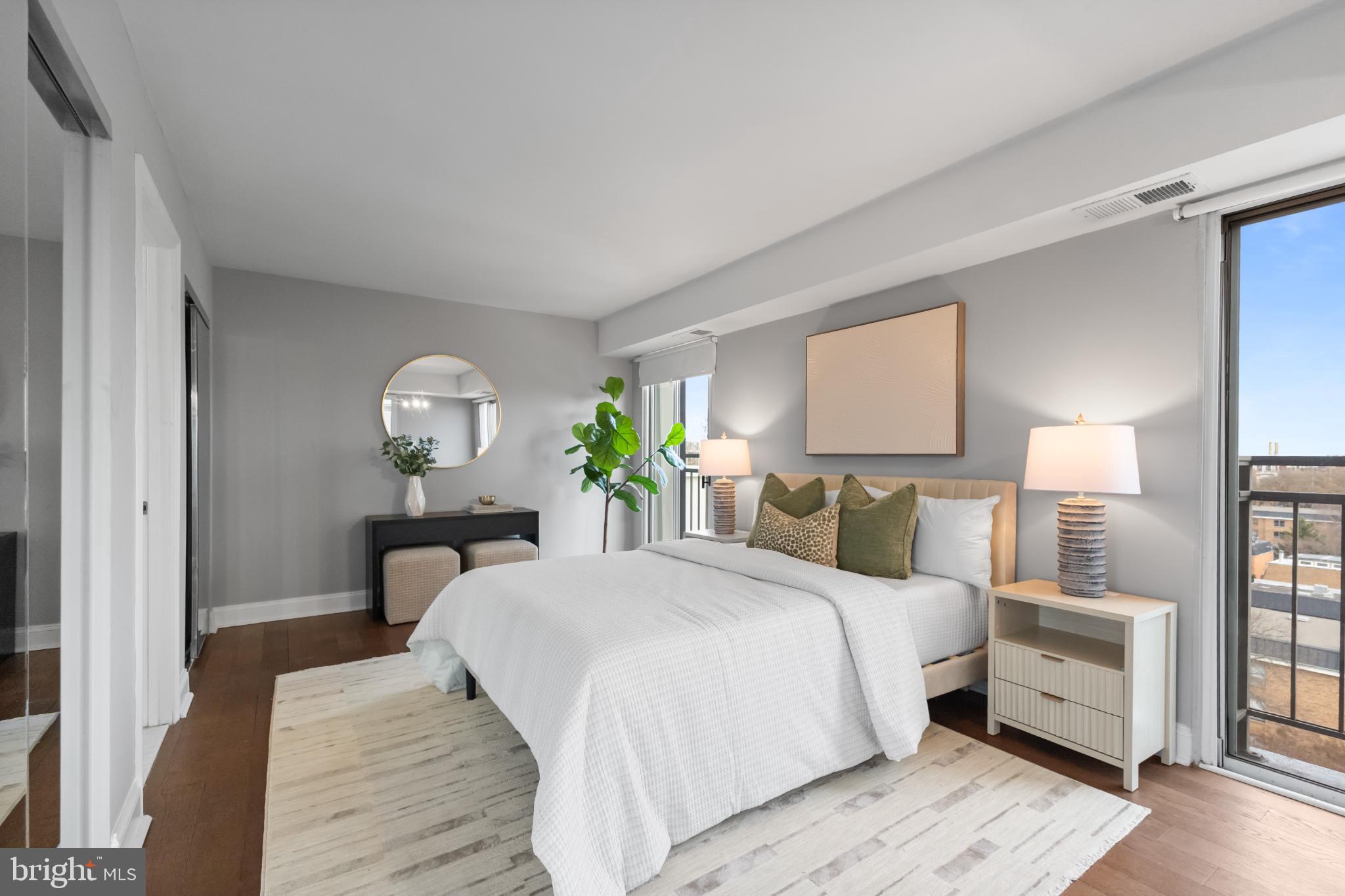 700 7th Street Southwest, Unit 813 Washington, DC 20024 - Photo 11 of 26 a bedroom with a bed and wooden floor