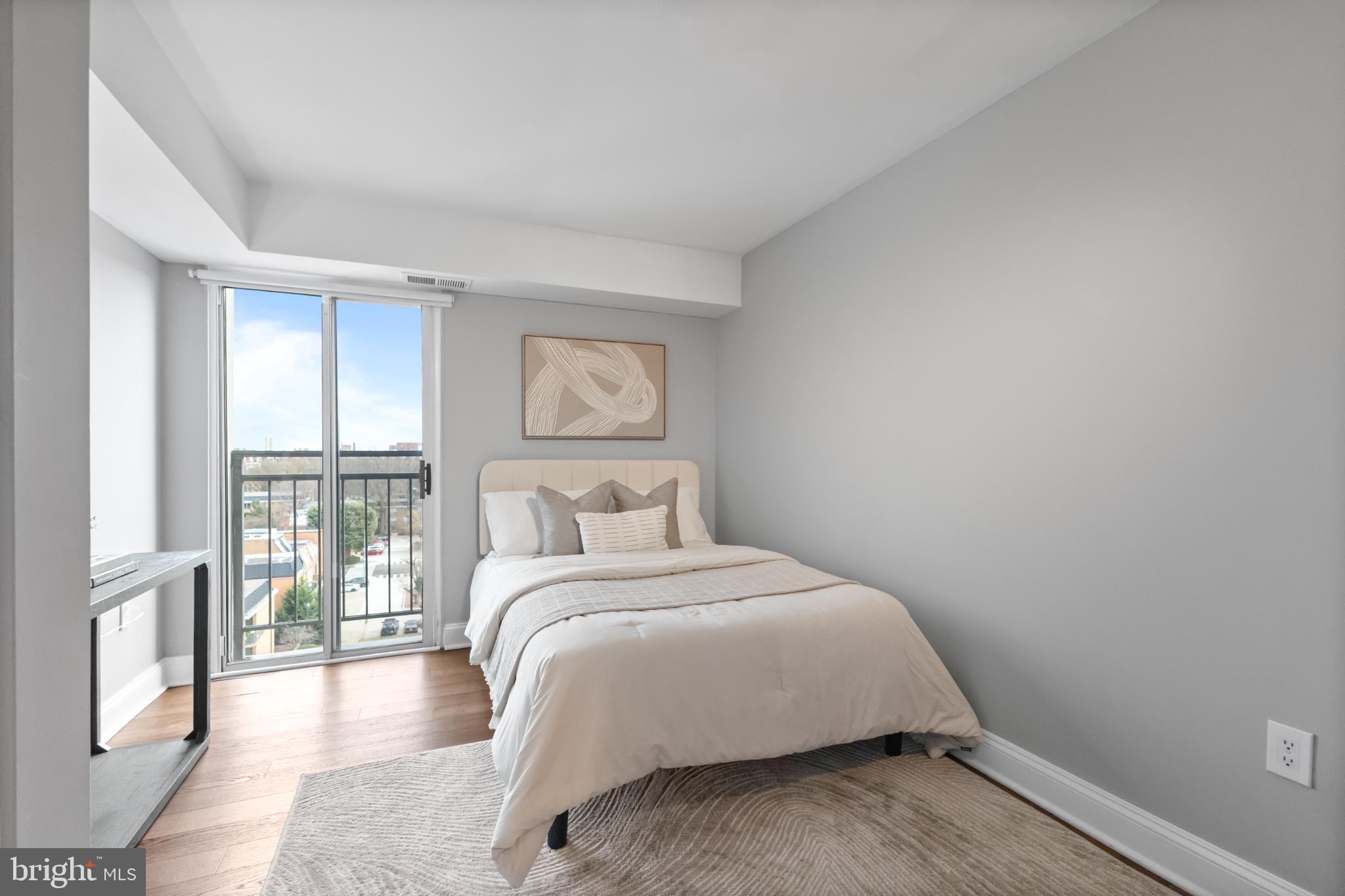 700 7th Street Southwest, Unit 813 Washington, DC 20024 - Photo 16 of 26 a bedroom with a bed and a window