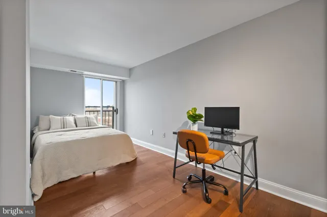 a bedroom with a workspace