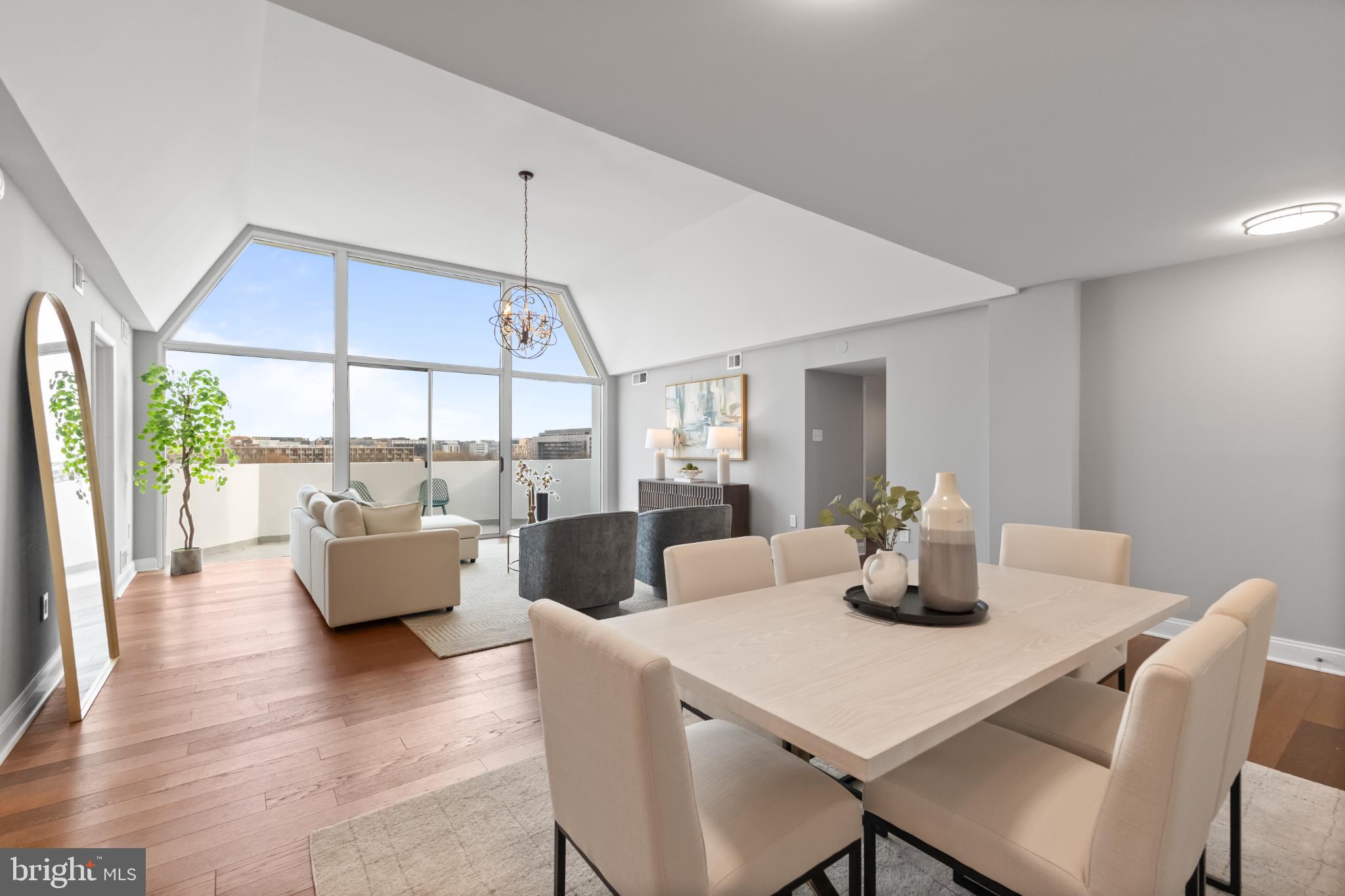 700 7th Street Southwest, Unit 813 Washington, DC 20024 - Photo 2 of 26 a dining room with wooden floor and windows