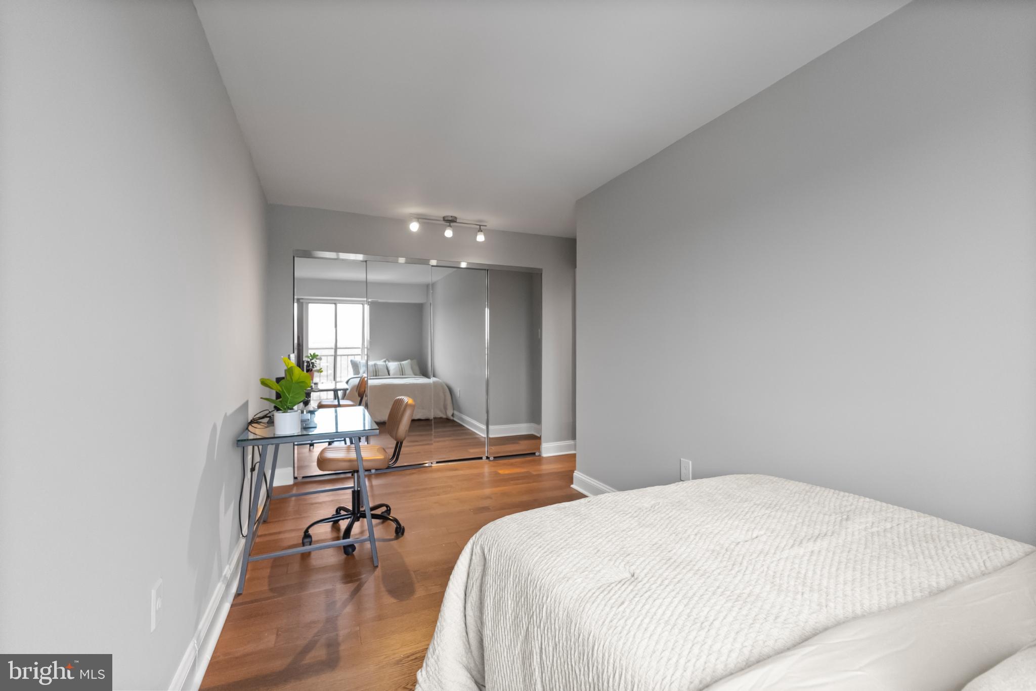 700 7th Street Southwest, Unit 813 Washington, DC 20024 - Photo 21 of 26 a living room with furniture and a chandelier