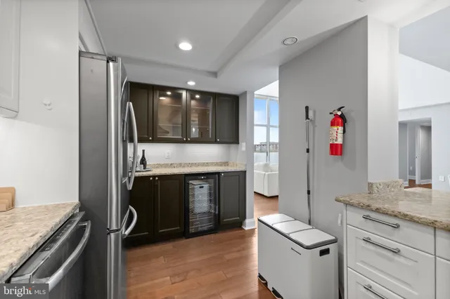 a kitchen with stainless steel appliances granite countertop a stove and a refrigerator