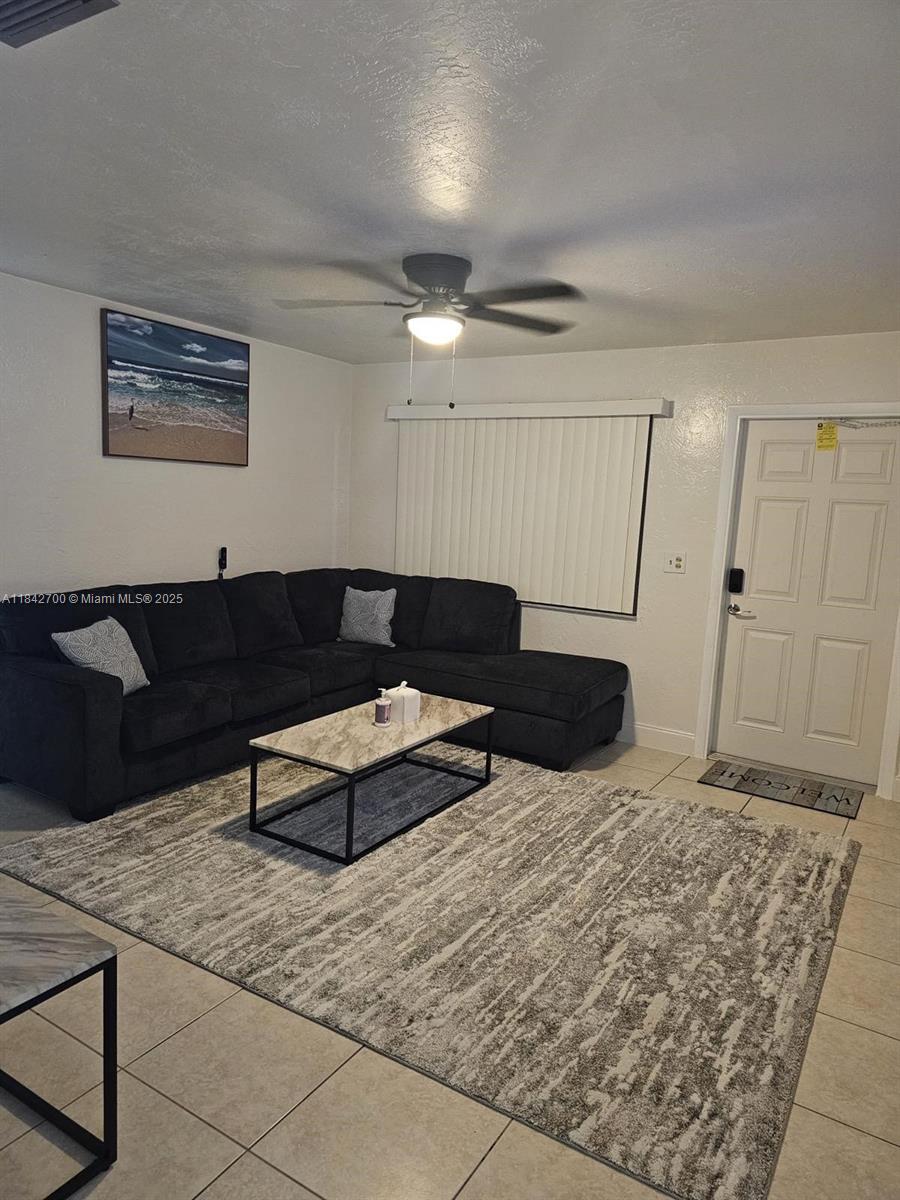 5929 Fillmore Street, Unit A Hollywood, FL 33021 - Photo 1 of 24 a living room with furniture a rug and a couch