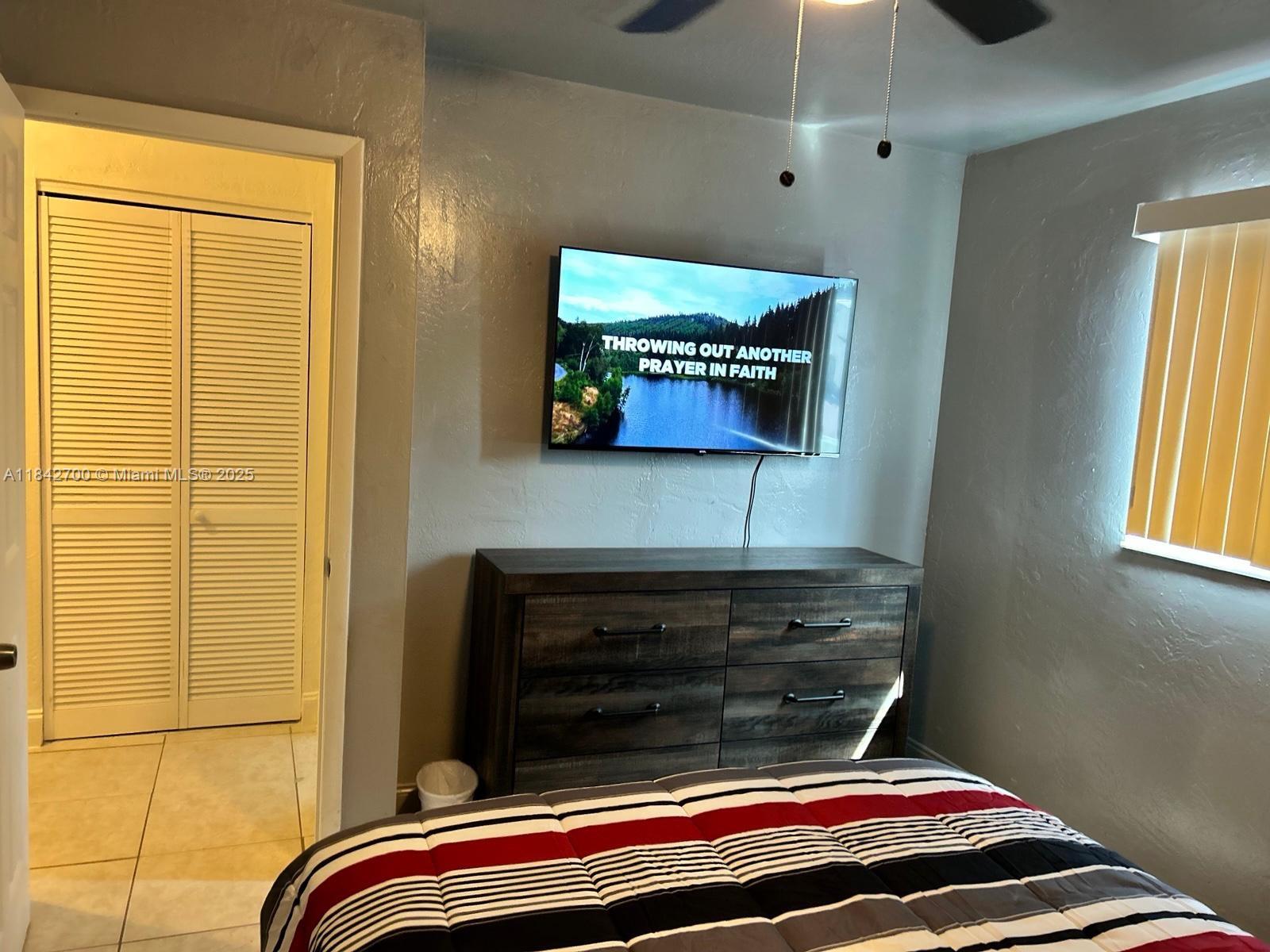 5929 Fillmore Street, Unit A Hollywood, FL 33021 - Photo 20 of 24 a room with a bed and a window